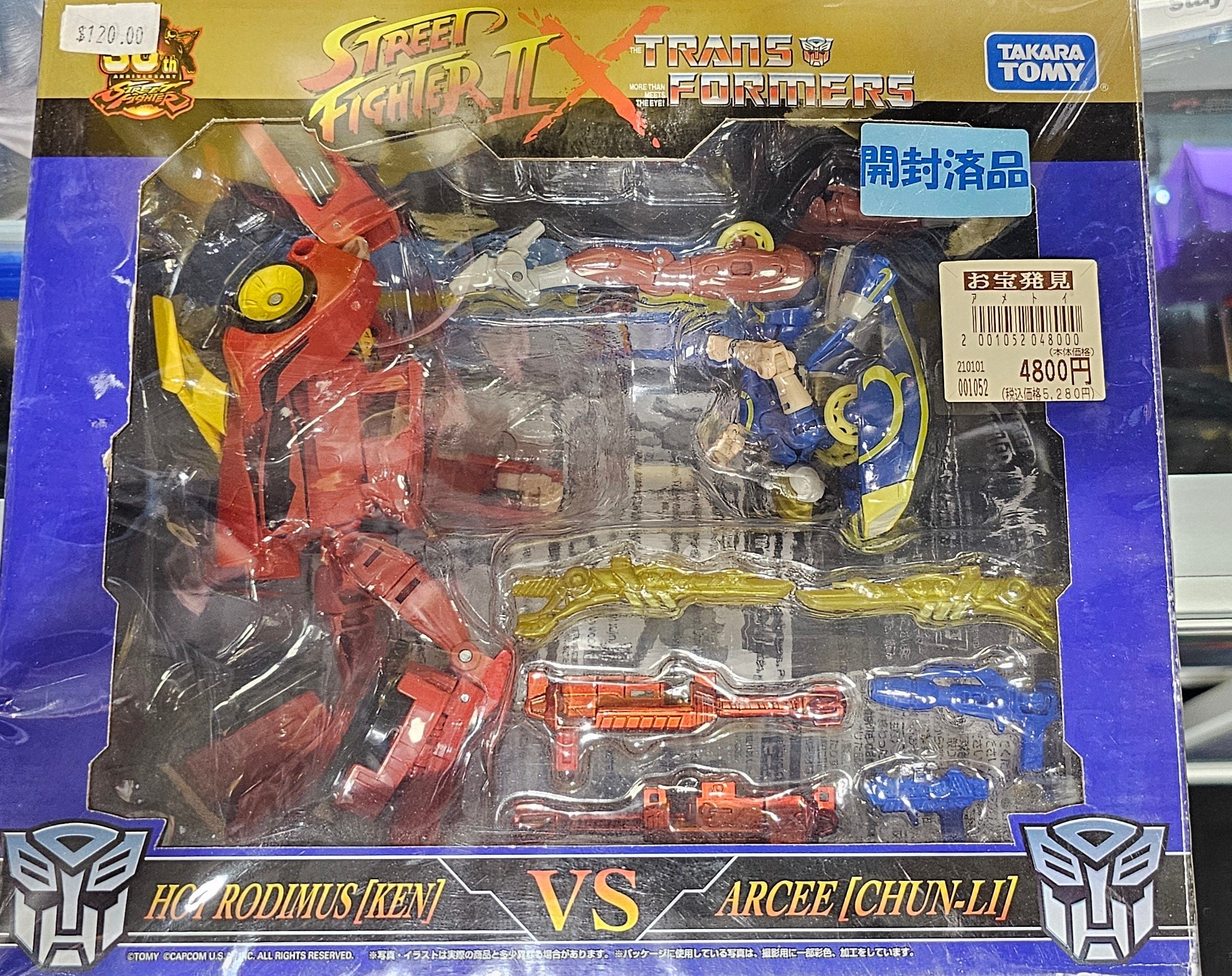 Transformers x Street Fighter II: Hot Rodimus (Ken) VS. Arcee (Chun - Li) - Vault 82